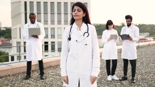 Medical Team Stands Together on a Rooftop
