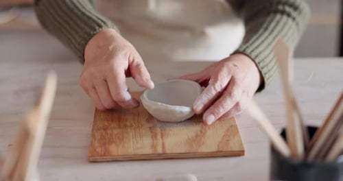 Clay bowl, woman hands and sculpture in artist studio, workshop and small business of creative