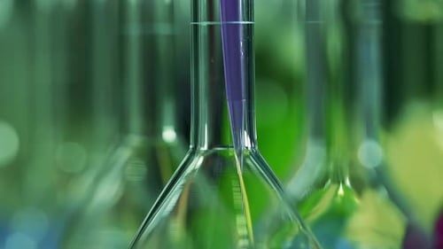 Dropping Liquid into Test Tube for Research