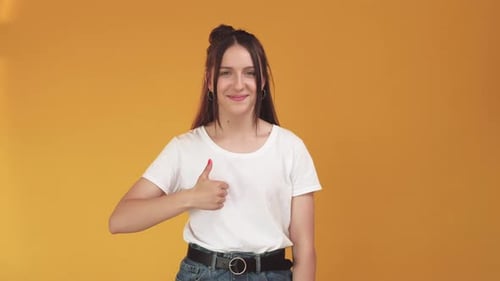 Young Adult Gives Thumbs Up Approval