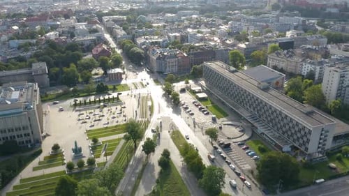 Aerial drone backward moving shot of urban city of Krakow, Cracow, Poland during evening time.