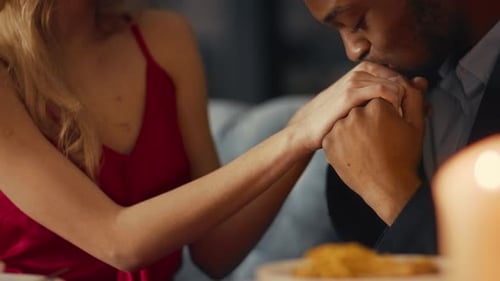 Couple Sharing a Romantic Moment During a Dinner Date in a Cozy Restaurant
