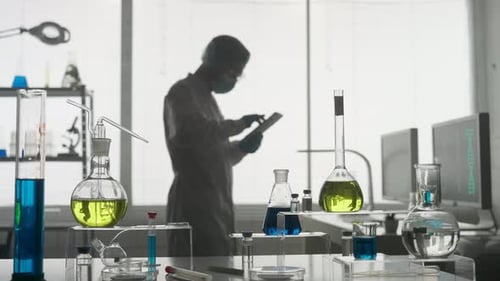 Laboratory of Modern Medical Research A Male Researcher Uses a Tablet in a Laboratory A Man Analyzes