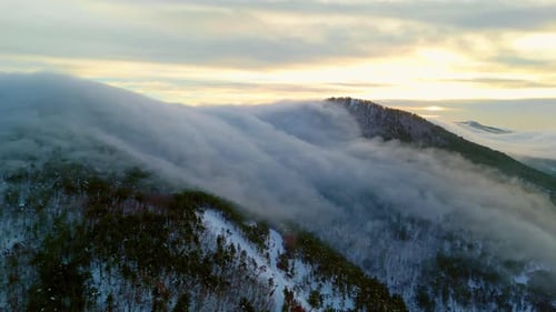 Golden Clouds Over Misty Mountain Peaks 4K