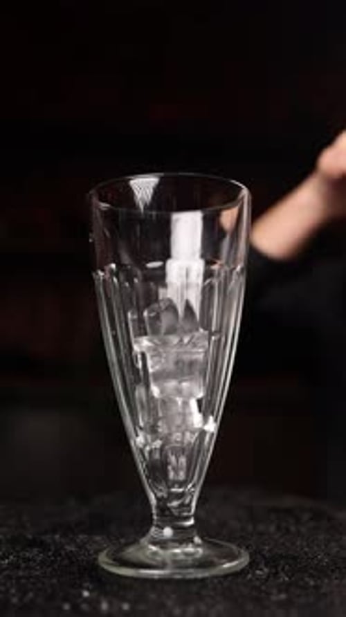 bartender prepares a cocktail at the bar