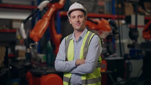 Smiling Portrait of Industrial Engineer Foreman with Arms Crossed