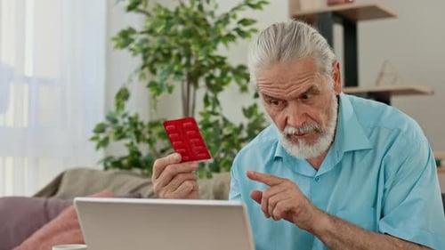 Senior Man Discusses Medication via Video Call