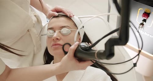 Woman Receiving Laser Skin Treatment in Clinic