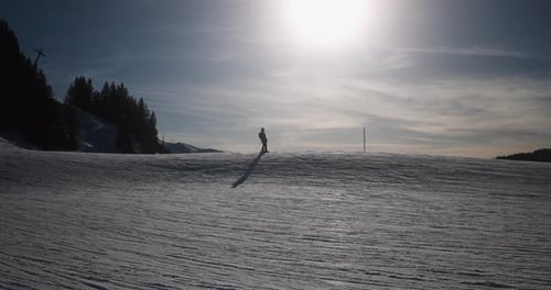 Woman Skiing in Alps Mountains on Sunny Day - Skier Riding Down