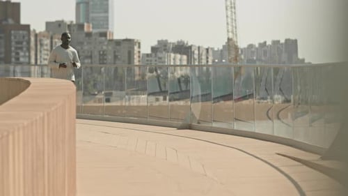 African American Man Running in City