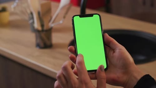 Tokio Japan April 7 2018 Close Up Woman Hand Hold Use Smartphone with Vertical Green Screen on