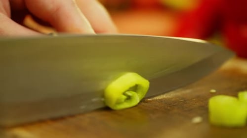 Slow Motion Video of Slicing Green Chili Peppers
