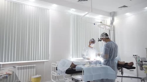 Surgeons Perform Operation in Sterile Hospital Setting