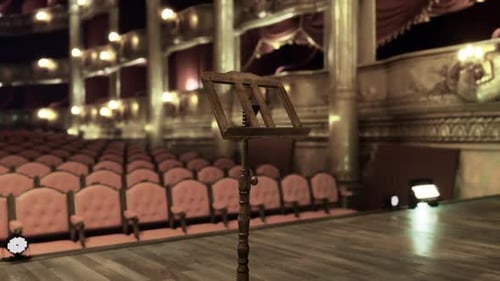 Elegant Opera House Featuring Gilded Decorations and Plush Upholstery