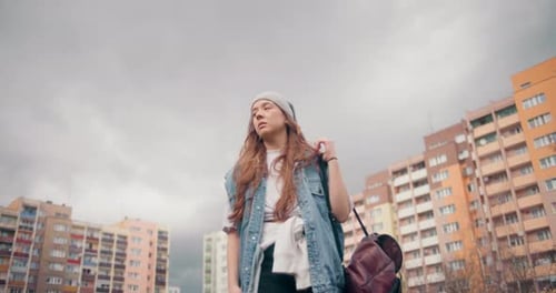 Young Adult Female with Buildings in City
