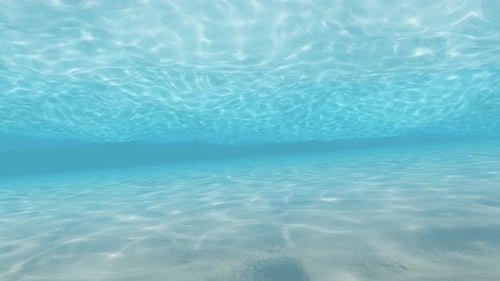 Seamless Underwater Loop with Rippling Light and Sandy Bottom