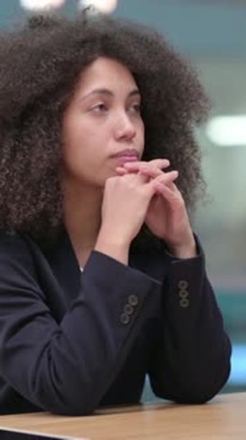 African Businesswoman Sitting in Office and Thinking, vertical video