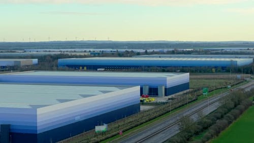 Expansive Logistics Warehouses Operating Alongside Highway Infrastructure Industrial Distribution