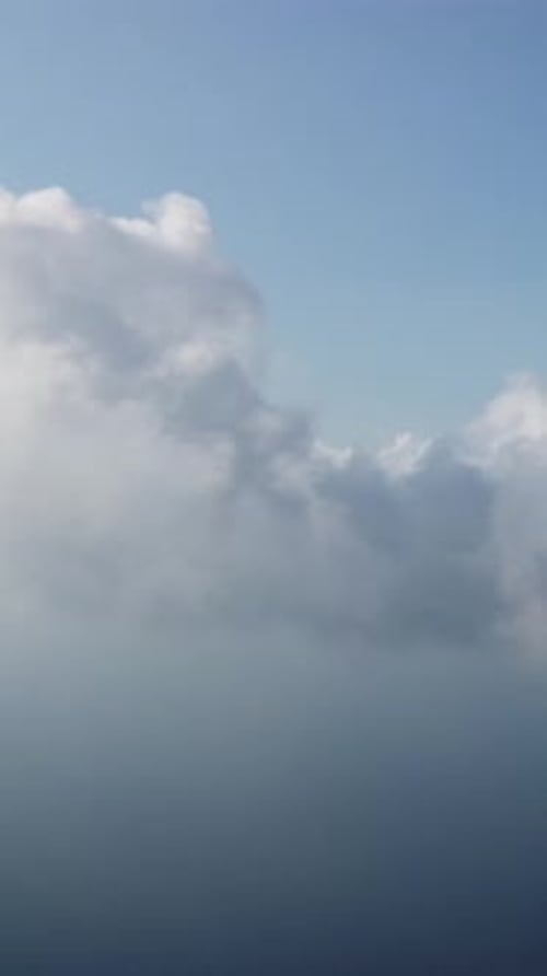 Aerial Vertical View Over Foggy and Fluffy Clouds Blue Sky Sun and Sea Fog Abstract Aerial Nature