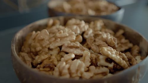 Walnut Halves Filling Wooden Bowl, Healthy Snack