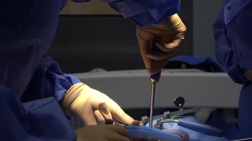 Medical Professionals Performing Surgery in Hospital Room