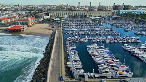 Drone Shot of King Harbor Yacht Club Marina, Redondo Beach Breakwall and Waterfront Buildings, Calif