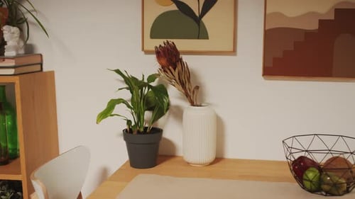 Cozy Dining Place with Table and Chaires for Family and Retro Posters