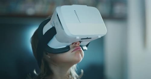 Child Wearing Virtual Reality Headset Looking Up
