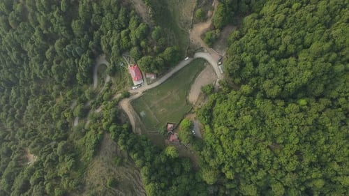 Aerial shot of a hidden temple between the dense forest.
