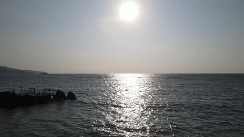 Beautiful aerial sunset view over sea surface beautiful wave. Amazing light sunset or sunrise sky