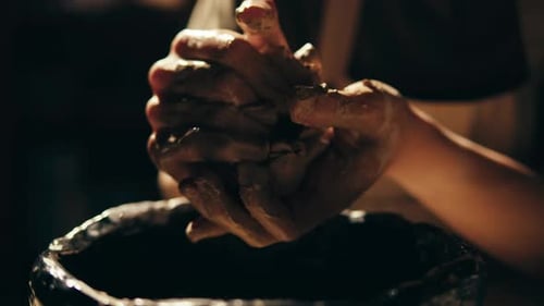 Man Potter Works with Clay on Master Class in Studio Working Process in Ceramic Workshop Potter