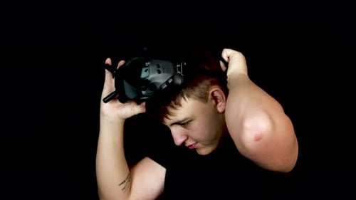 Young Man Wearing VR Goggles Virtual Reality First Person View Headset, Close Up