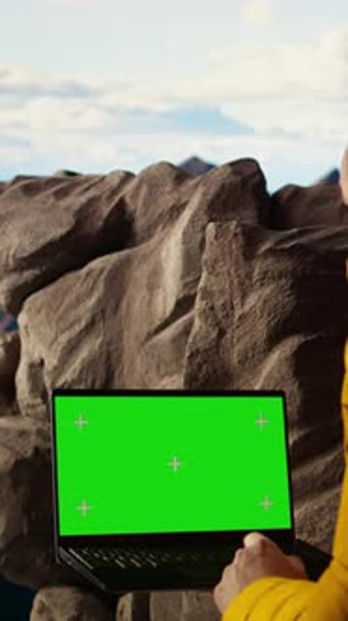 Vertical Video Trekker Takes in the Panoramic Landscape Next to Isolated Mockup Screen