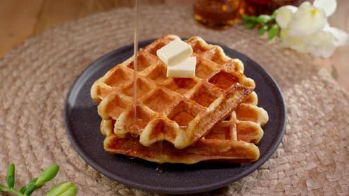 Golden Syrup Poured on Stack of Waffles