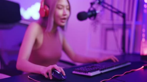 Enthusiastic Young Woman Gamer Celebrates Success