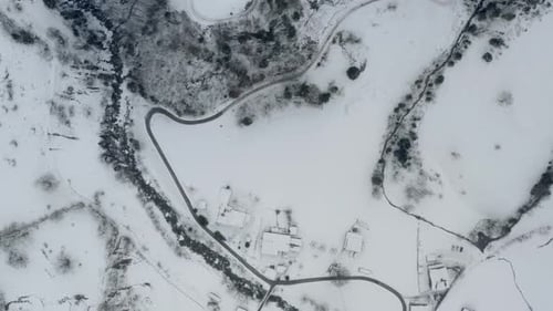 Drone Aerial of Lauterbrunnen surrounded by the Mountain Eiger in the swiss alps. The winter in Swit