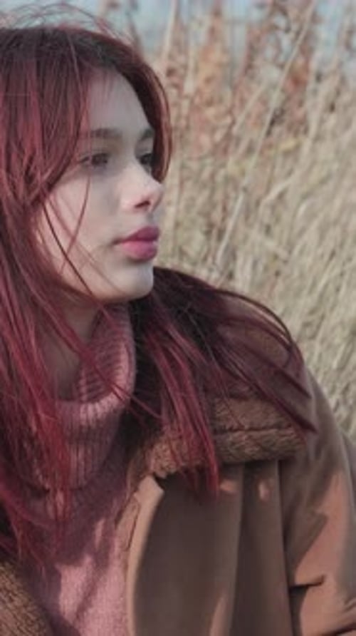 Young Woman with Reddish-Brown Hair Outdoor Portrait