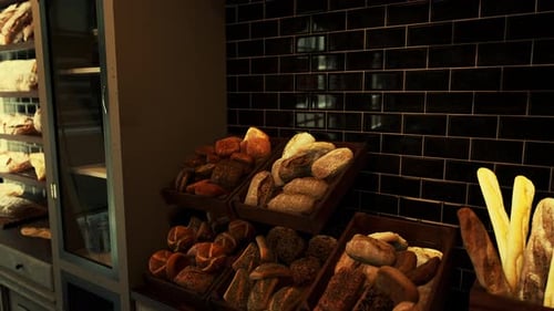 Assorted Types of Bread Displayed in a Store Case