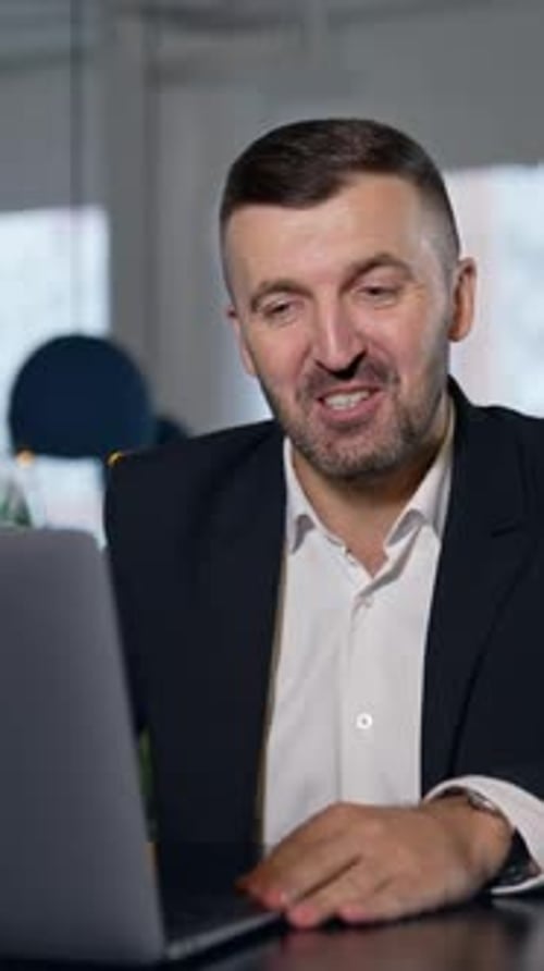Professional Man in Suit Having Video Call