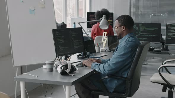 Black Male Software Engineer Program Coding on Desktop Computer in ...