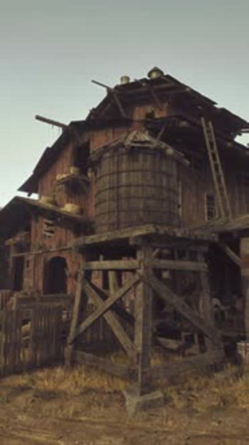 An Abandoned Wooden Building in the Midst of a Barren Desert Landscape