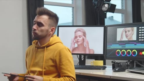 Freelance Videographer Colorist Editing Footage Using Professional Software Monitor and Montage