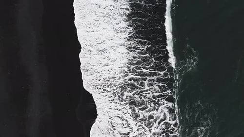 The Black Sand Beach in Iceland Sea Aerial View and Top View