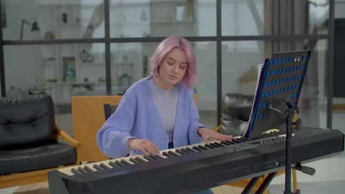 Woman Plays Electric Piano in Modern Home