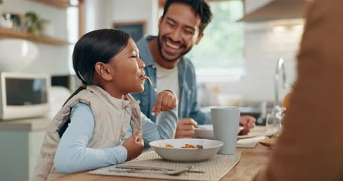 Happy Family Enjoying Lunchtime Together at Home