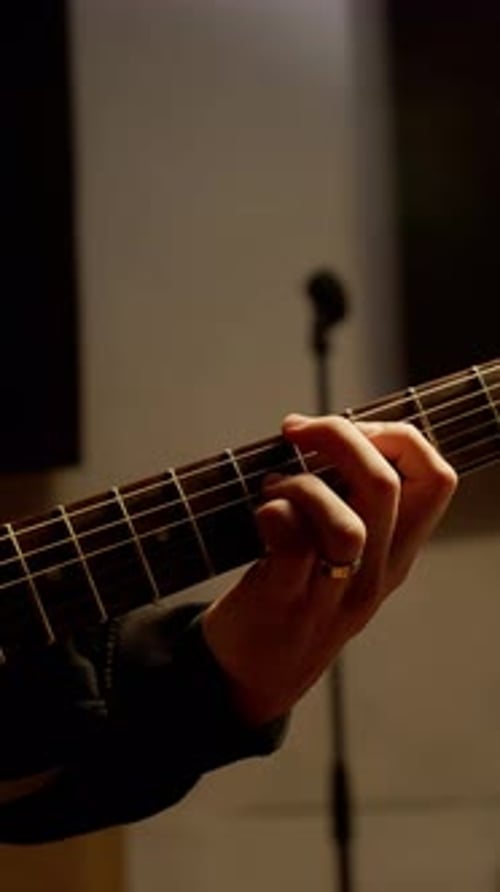 Close Up of Hands Playing Electric Guitar