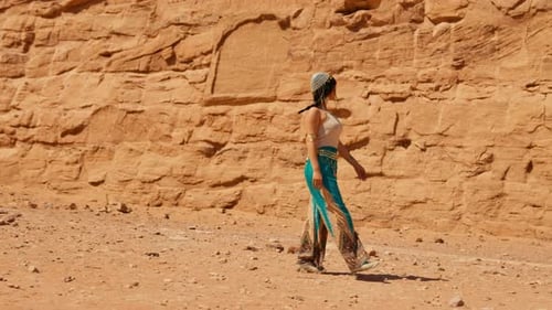 Woman Walking Along the Great Temple of Ramses II of Abu Simbel