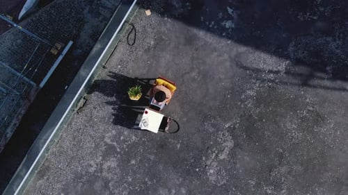 An Absolutely Stunning Aerial View of a Person Actively Engaged in Working with a Portable Generator