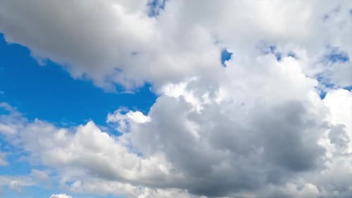 Flying along fluffy soft cotton clouds on beautiful sunny summer day. Heavenly cumulus white clouds