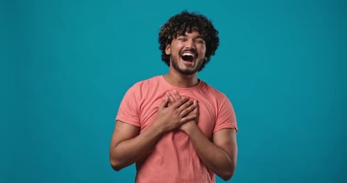 Young Indian Man Pointing Finger to Camera Laughing Out Loud Taunting Making Fun of Ridiculous